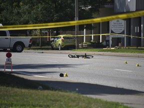 A fallen bicycle on Ouellette Avenue at Shepherd Street West in Windsor following a hit-and-run collision on the morning of Aug. 6, 2022.