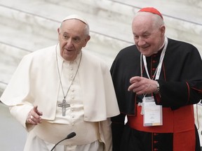 Pope Francis, left, and Cardinal Marc Ouellet arrive at the opening of a 3-day Symposium on Vocations in the Paul VI hall at the Vatican on Feb. 17, 2022. A series of claims made against Quebec clergy members in two class-action lawsuits against the church could be groundbreaking for victims who aren't children.