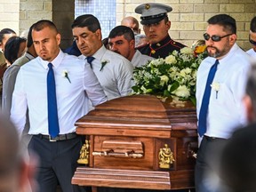Pallbearers and U.S. Marine Christian Garcia, son of Linda Garcia, carry the casket of Irma Linda Garcia and her husband Jose Antonio Garcia during their funeral mass at Sacred Heart Catholic Church in Uvalde, Texas, on June 1, 2022.