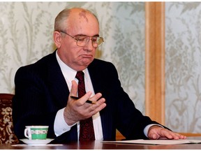 In this file photo taken on Dec. 25, 1991, Soviet President Mikhail Gorbachev reads his resignation statement shortly before appearing on television in Moscow, to announce his decision to the Nation.