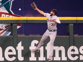 Detroit Tigers center fielder Riley Greene leaps but is unable to catch the home run hit by Texas Rangers shortstop Corey Seager during the ninth inning at Globe Life Field. The Tigers won 9-8.
