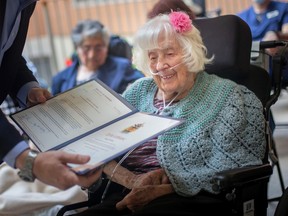 Zofia Leblanc, who turns 99 on November 12, receives a certificate from Mayor Drew Dilkens, during a birthday celebration of nine centenarians at Huron Lodge, on Tuesday, August 23, 2022.