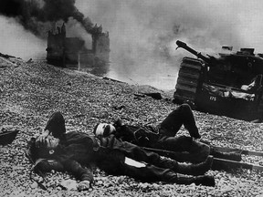George Brown of Leamington fought at Dieppe, was captured, escaped, swam into the channel and was rescued. Shown is a photo of Brown, foreground, as he lay injured on the beach at Dieppe.
