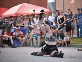 Isabella Hoops of the NorthFIRE Circus performs at Busk On the Block in Windsor's Walkerville area on Aug.  6, 2022.
