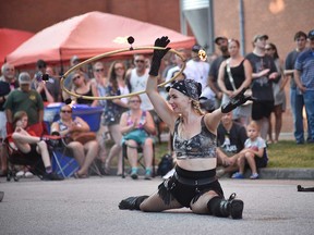 Isabella Hoops of the NorthFIRE Circus performs at Busk On the Block in Windsor's Walkerville area on Aug. 6, 2022.