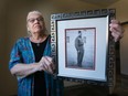 Theresa Sims, Windsor Indigenous storyteller, will be accompanying vets and is a special guest of the Dieppe Raid 80th anniversary that Windsor is hosting. Sims poses Aug. 12, 2022, with a photo of her father Robert James Sims who survived the Dieppe Raid on Aug. 19, 1942, but was seriously injured.