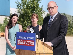 Windsor Mayor Drew Dilkens announces his bid for re-election on Friday, August 12, 2022 with his daughter Madison and wife Jane Deneau by his side.