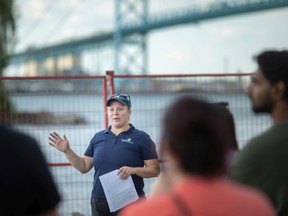 Gina Pannunzio, partnerships and outreach coordinator at the Essex Region Conservation Authority, leads an environmental walking tour to highlight the Detroit River environmental successes in the community of Sandwich, on Tuesday, August 23, 2022.