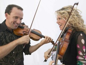 Canadian fiddling legends Donnell Leahy and Natalie MacMaster in a promotional image.
