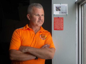 David Lenz, director of community development with Windsor-Essex Pride Fest, works at the Windsor Pride office on Aug. 5, 2022.