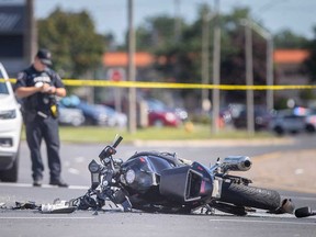 The wreckage of a motorcycle involved in a collision with a car at the intersection of Dougall Avenue and Ouellette Place in Windsor on Aug. 16, 2022.