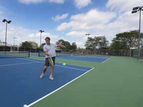 Play ball. Igor Frenkel tries out the new tennis courts at the Forest Glade Optimist Park on Monday, Aug. 29, 2022. Park upgrades totalled $850,000.