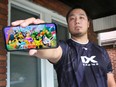 Steve Tran shows the game he's mastered: Pokemon UNITE. Tran will compete in the 2022 Pokemon World Championships in London, England, Aug. 18-21. Photographed at his residence in Windsor on Aug. 11, 2022.