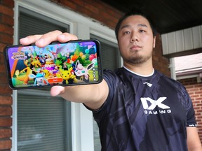 Steve Tran shows the game he's mastered: Pokemon UNITE. Tran will compete in the 2022 Pokemon World Championships in London, England, Aug. 18-21. Photographed at his residence in Windsor on Aug. 11, 2022.