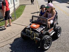 Jaxson and Katelynn Hurst (From left to right) go for a drive during the Safety Village first Community Safety Day.