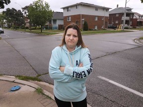 Walkerville resident Jennifer Chatzilaskaris stands at the intersection of Gladstone Avenue and Richmond Street where a two-vehicle hit-and-run collision occurred the night before. Photographed in Windsor Aug. 29, 2022.