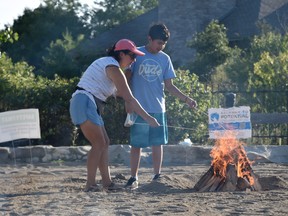 Families roasted marshmallows on the beach on Saturday, Sept. 3, 2022 at Tecumseh's annual end-of-summer bonfire. For the first time since the onset of the COVID-19 pandemic, Lakewood Park saw lawn games, live entertainment, and a fireworks show for the family-favourite event after the sun went down.