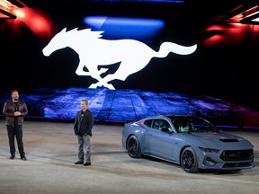 Ed Krenz (R), Ford Mustang chief engineer, discusses the seventh generation 2024 Ford Mustang at its global debut at a Mustang Stampede event at the 2022 North American International Auto Show on September 14, 2022 in Detroit, Michigan. The North American International Auto Show opens to the public on September 17.