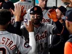 Eric Haase of the Detroit Tigers celebrates his home run with teammates in the sixth inning against the Kansas City Royals at Kauffman Stadium on September 09, 2022 in Kansas City, Missouri.