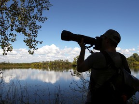 The annual Festival of Hawks hosted by the Essex Conservation Authority at Holiday Beach in Amherstburg makes its return this month. A birder with a big lens is shown at an earlier festival in 2018. Photography tips will be  part of the 2022 event.