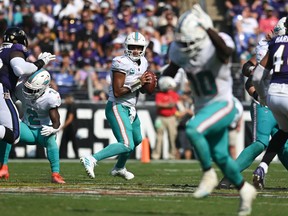 Miami Dolphins quarterback Tua Tagovailoa looks to throws to wide receiver Tyreek Hill (10) during the second half against the Baltimore Ravens at M&T Bank Stadium. (Tommy Gilligan-USA TODAY Sports