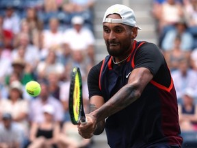 Nick Kyrgios of Australia plays a backhand against Benjamin Bonzi of France in their men's singles match at the U.S. Open at USTA Billie Jean King National Tennis Center in New York City, Wednesday, Aug. 31, 2022.