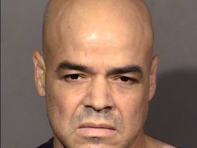In this handout provided by the Las Vegas Metropolitan Police Department, Clark County Public Administrator Robert Telles poses for a mugshot after being charged in the death of Las Vegas Review-Journal investigative reporter Jeff German.