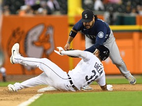 Seattle Mariners third baseman Eugenio Suarez tags out Detroit Tigers centre fielder Riley Greene  at third base in the fifth inning at Comerica Park.