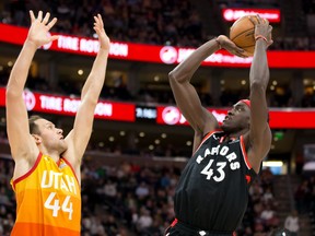 Forward Bojan Bogdanovic, at left, is seen with the Utah Jazz defending Toronto Raptors' forward Pascal Siakam.  Bogdanovic is reportedly set to be dealt to the Detroit Pistons by the Jazz for Canadian centre Kelly Olynk and guard Saben Lee.