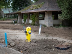 A newly installed fire hydrant and sewer drain are seen on the southern half of Bois Blanc where 220 residential lots are now ready for development, on Saturday, Sept. 24, 2022.