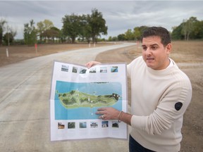 Derrick Amicone, project manager with Amico, goes over a map of the southern half of Bois Blanc where 220 lots are now ready for development, on Saturday, Sept. 24, 2022.