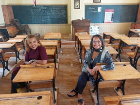 Dr. Calinda N. Lee, left, founder of Sources Cultural Resources Management, and Shannon Prince, curator of the Buxton National Historic Site & Museum, are seen here in the 1861 school house located on the site, during a visit by Lee on Wednesday. (Ellwood Shreve/Chatham Daily News)