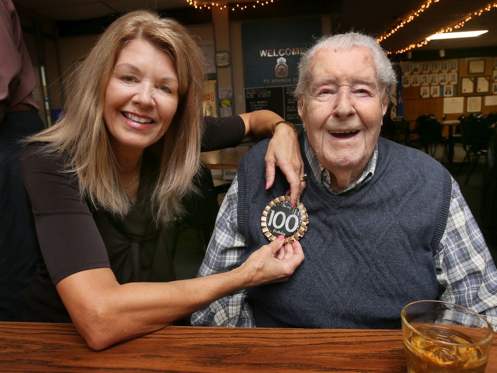 Second World War vet Charles Davis celebrated his 100th birthday at the Royal Canadian Legion Branch 255 in Windsor on Tuesday, September 27, 2022. His daughter Terri Davis-Fitzpatrick places a special badge on him during the celebration.