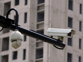 Surveillance cameras are seen near residential buildings in this file photo.