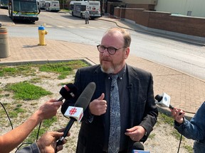 Mayoral candidate Chris Holt shares his plan to invest in public transit in front of the Tecumseh Mall transit terminal in Windsor on Thursday, Sept. 15, 2022.