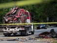 A flatbed truck prepares to move the wreckage of a car involved in a single-vehicle collision in the 2500 block of Princess Ave. in Windsor. Photographed Sept. 15, 2022.