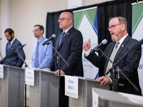 Windsor mayoral candidates, from left, Matthew Giancola, Benjamin Danyluk, Drew Dilkens and  Chris Holt, debate during the 2022 City of Windsor Mayoral Election Debate hosted by the Windsor-Essex Chamber of Commerce and YourTV at the Serbian Centre, on Thursday, Sept. 29, 2022.