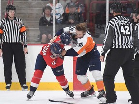 Windsor Spitfires Ryan Abraham (left) battles the Flint Firebirds' Ethan Hay in one of three bouts during Sunday's exhibition game in Flint. Photo Todd Boone/Flint Firebirds