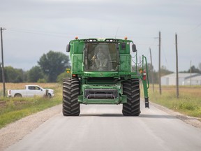 Heavy farm equipment travels on Sexton Side Road in Essex County on Sept. 15, 2022.