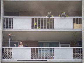 Windsor fire crews work to contain a fire in a residential apartment on the 15th floor of Ouellette Manor at 920 Ouellette Ave., on Wednesday, Sept. 21, 2022.
