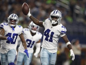 Dallas Cowboys safety Markquese Bell celebrates making an interception against the Seattle Seahawks in the third quarter at AT&T Stadium.