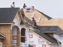 Construction workers are shown on Tuesday, September 6, 2022, at a new home under construction at Lauzon Road and McHugh Street.