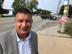 Windsor Ward 7 candidate Jeewen Gill on Thursday, Sept. 15, 2022, announced he would push for faster completion of Tecumseh Road East widening through his East Windsor ward. He's shown here pointing towards busy Forest Glade Drive intersection which currently has no left turn lanes for traffic.