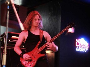 Windsor musician and suicide victim Jordan 'Cainer' Caine plays bass onstage in a photo courtesy of his friends.