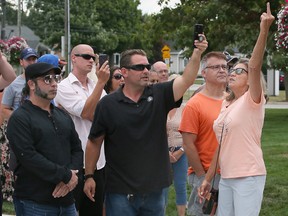 A group of demonstrators interrupt Windsor-Tecumseh MP Irek Kusmierczyk during a press conference on Monday, Aug. 22, 2022, at Tecumseh town hall. Some of the outbursts from the demonstrators included 'Go back to Poland' and 'We want freedom' and 'You're a traitor.'