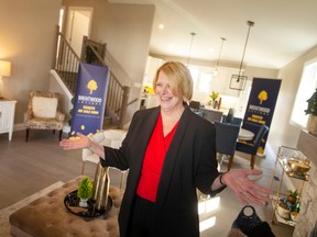 Elizabeth Dulmage, executive director at Brentwood Recovery Home, unveils the lottery dream home for the 31st Annual Dream Home Lottery, in Lakeshore, on Thursday, Sept. 29, 2022.