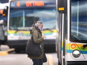 A Transit Windsor rider boards a bus at the downtown station on Tuesday, September 27, 2022. Riders will no longer be required to wear masks starting this upcoming Saturday.