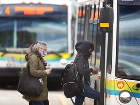 Transit Windsor riders board a bus at the downtown station on Tuesday, September 27, 2022. Riders will no longer be required to wear masks starting this upcoming Saturday.