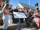 Essex Mayor Richard Meloche and members of council and the town's heritage committee unveil a historical plaque in McGregor on Thursday, Sept. 1, 2022.