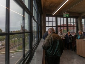 A group is guided through the Glos Arch+Eng offices at the newly restored Walker Power Building during Open Doors Windsor, on Saturday, Sept. 24, 2022.